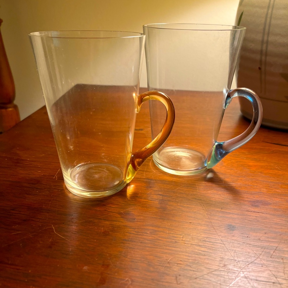 Vintage glass mugs with colorful handles